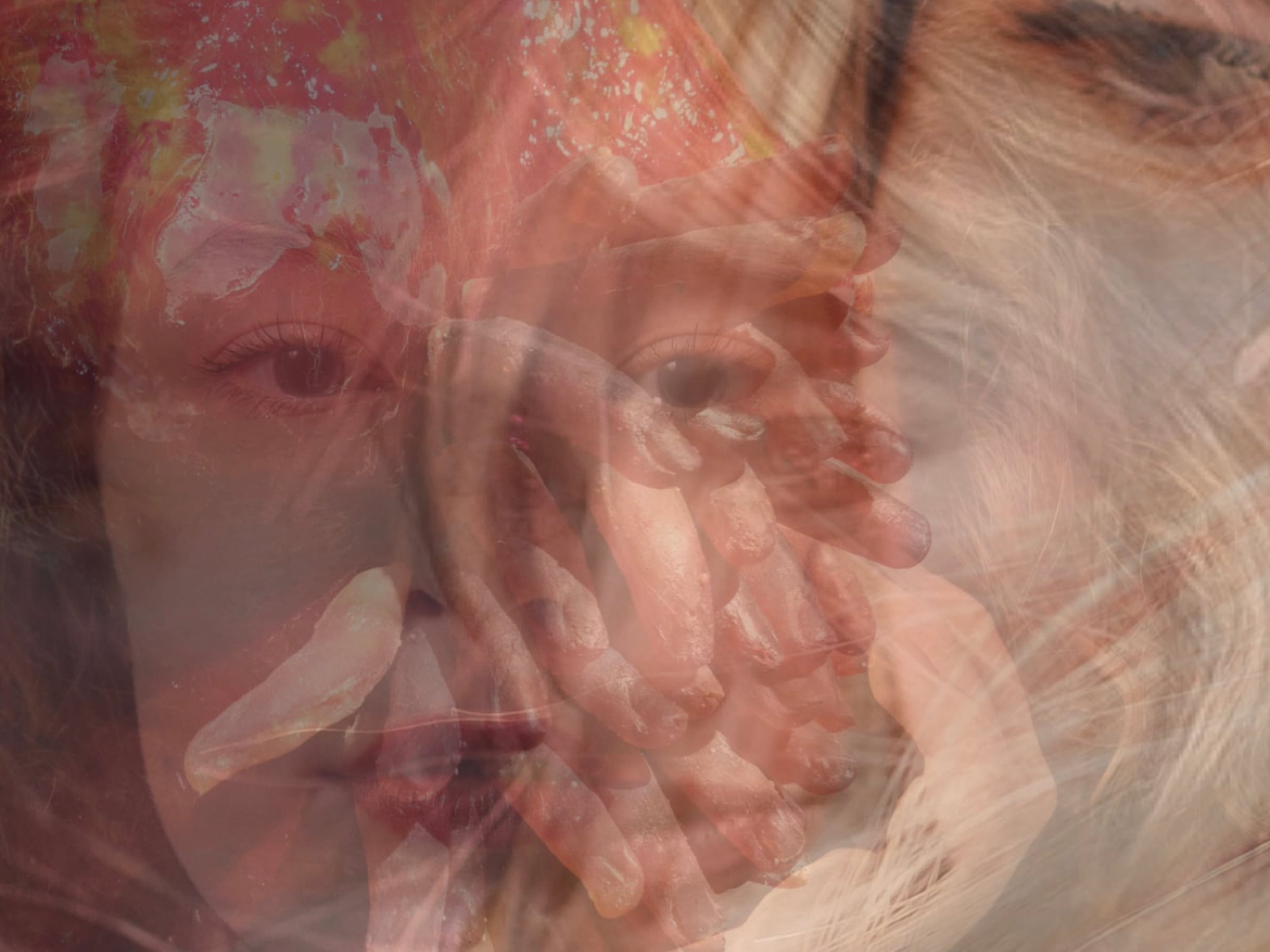 girl's face with many fingers