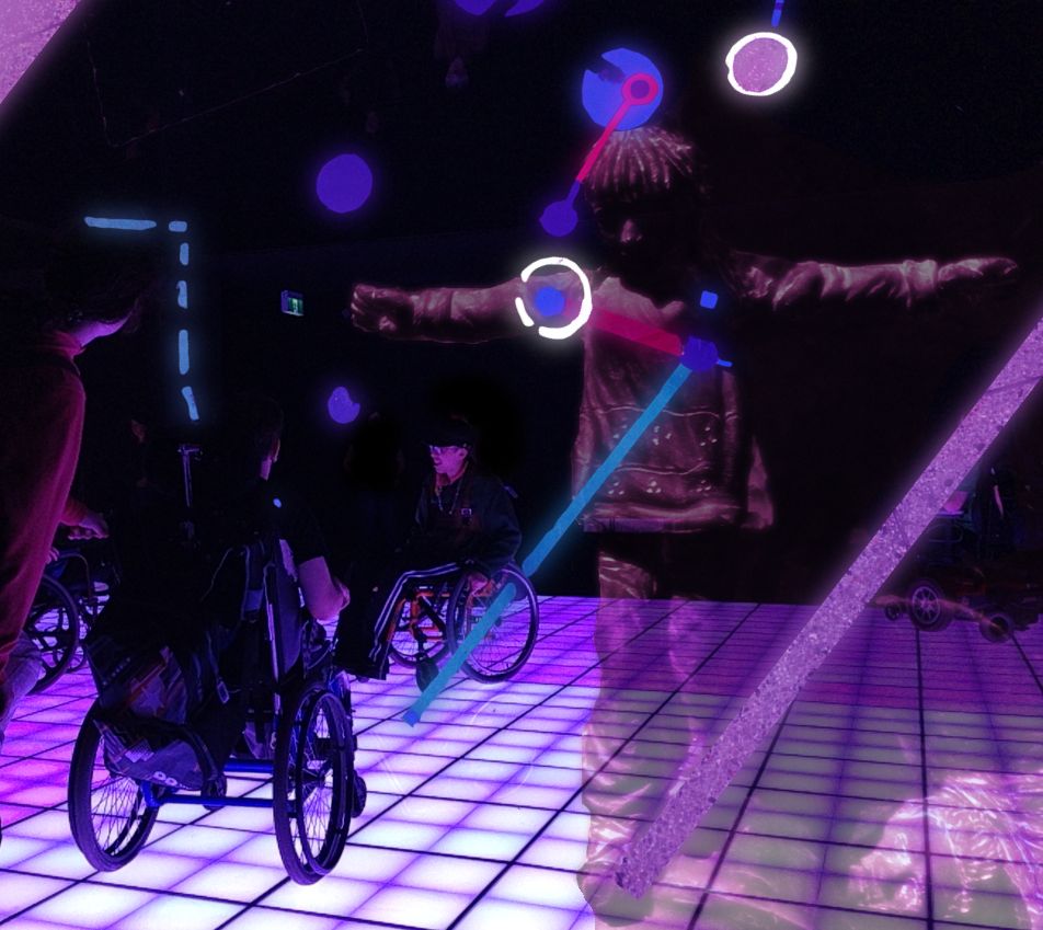 people in wheelchairs on a club dance floor lit from below with a Christ-like puppet figure hanging in the foreground