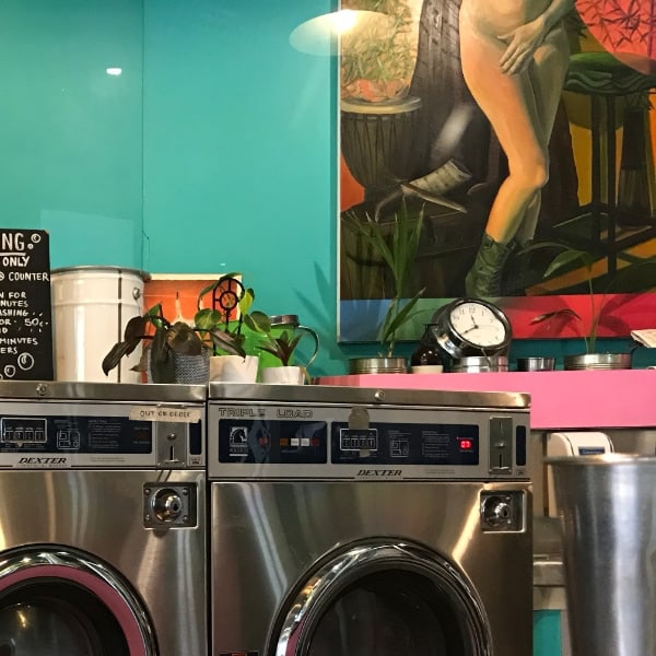 laundromat with painting of nude woman