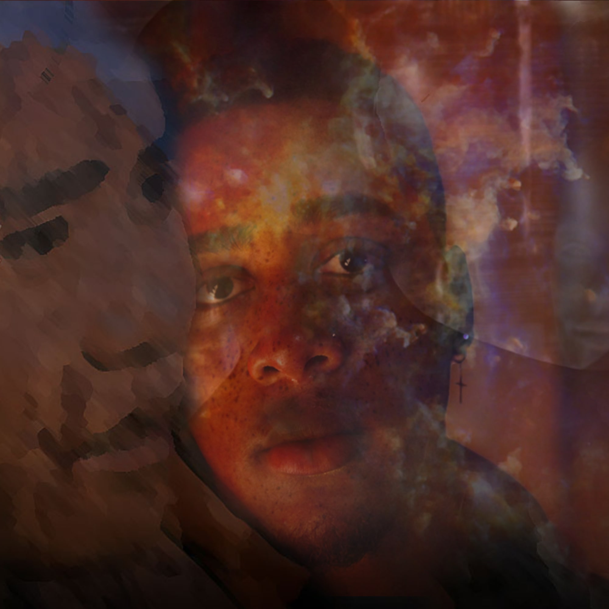 a black male face with a sad bright eye