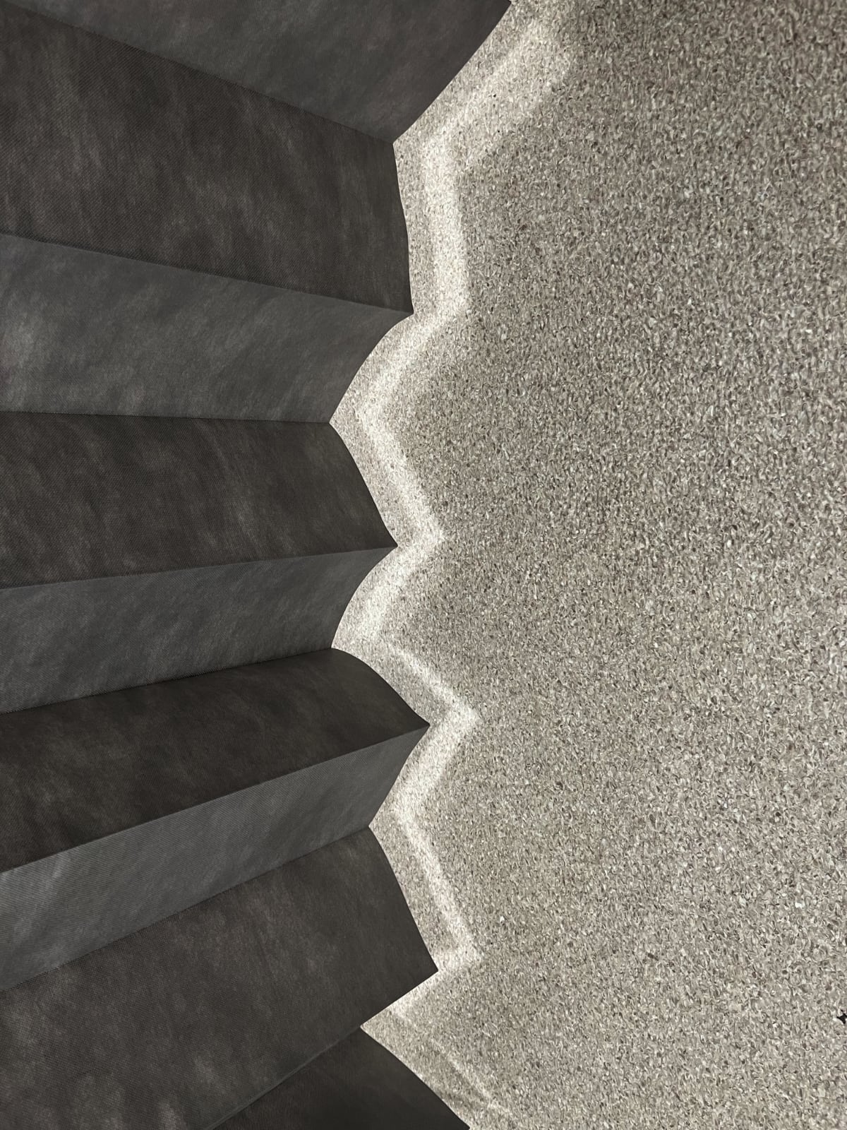 curtain for a cubicle in a hospital with light showing under onto floor